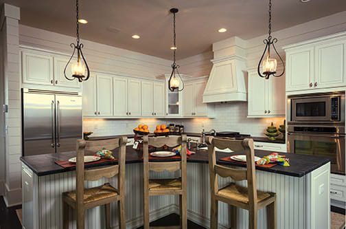 A Maple Kitchen featuring Monterey cabinet doors in Glacier Pewter from Wellborn Cabinet, Inc.