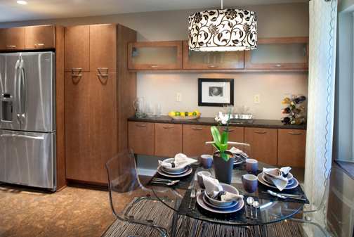 A Maple Dining Room featuring Milan cabinet doors in Medium from Wellborn Cabinet, Inc.