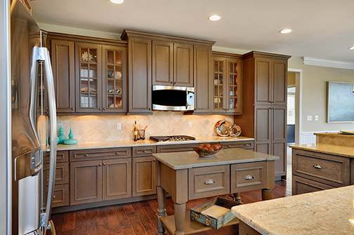 A Maple Kitchen featuring Melrose cabinet doors in Oatmeal Charcoal from Wellborn Cabinet, Inc.