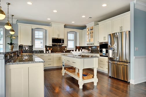 A Maple Kitchen featuring Hanover cabinet doors in Glacier Pewter from Wellborn Cabinet, Inc.