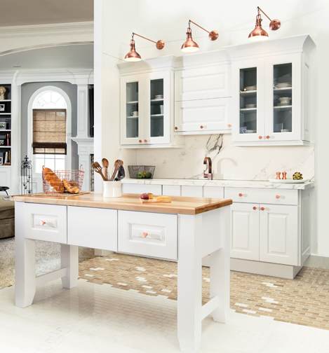 A Medium Density Fiberboard Kitchen featuring Trestle cabinet doors in Oyster White from Wellborn Cabinet, Inc.