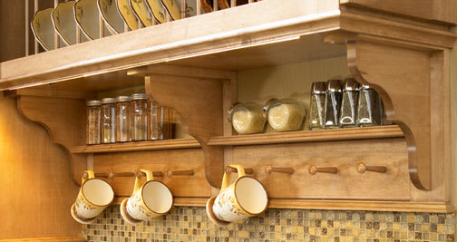 These Brown and Light cabinets for the 2012, 2011, and 2010 Exhibit Booth home were provided by Wellborn Cabinet, Inc.