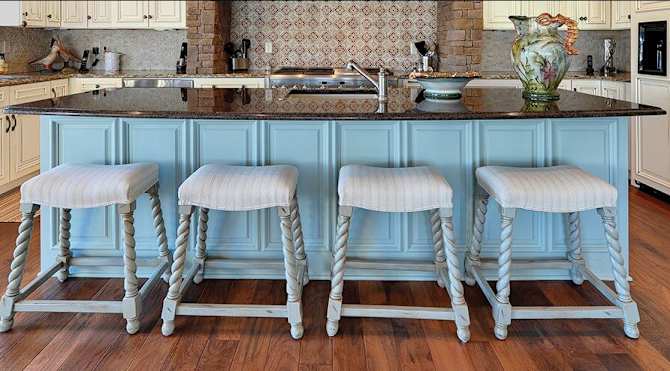 light aqua blue kitchen island with wainscot panel on bottom