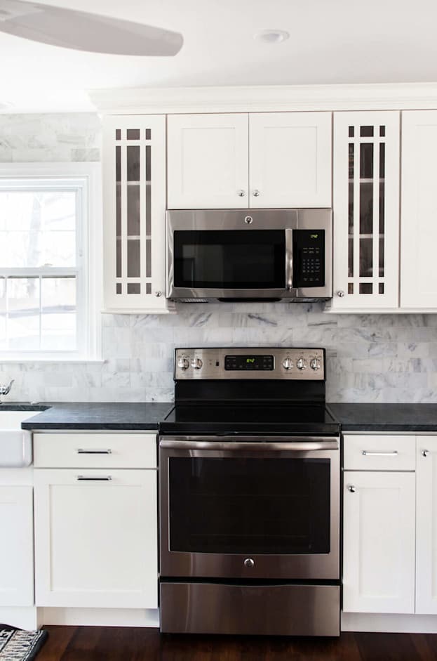 white shaker style cabinetry in kitchen small kitchen range