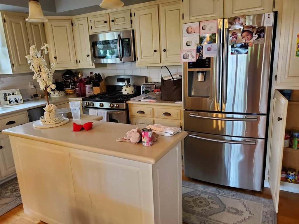 traditional kitchen with white cabinets and island