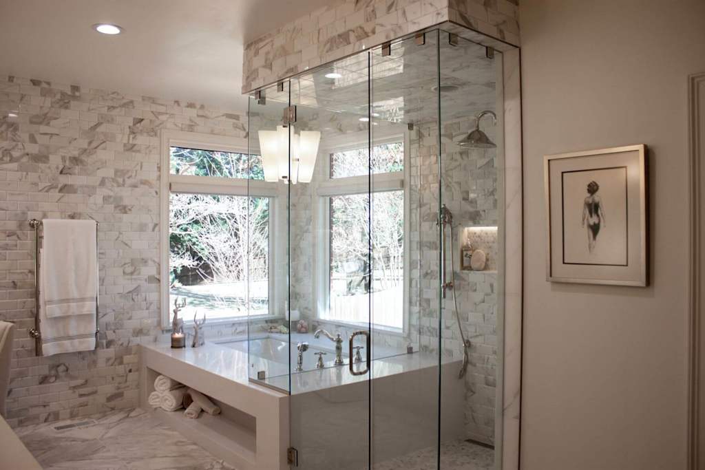 open bathroom with marble tub