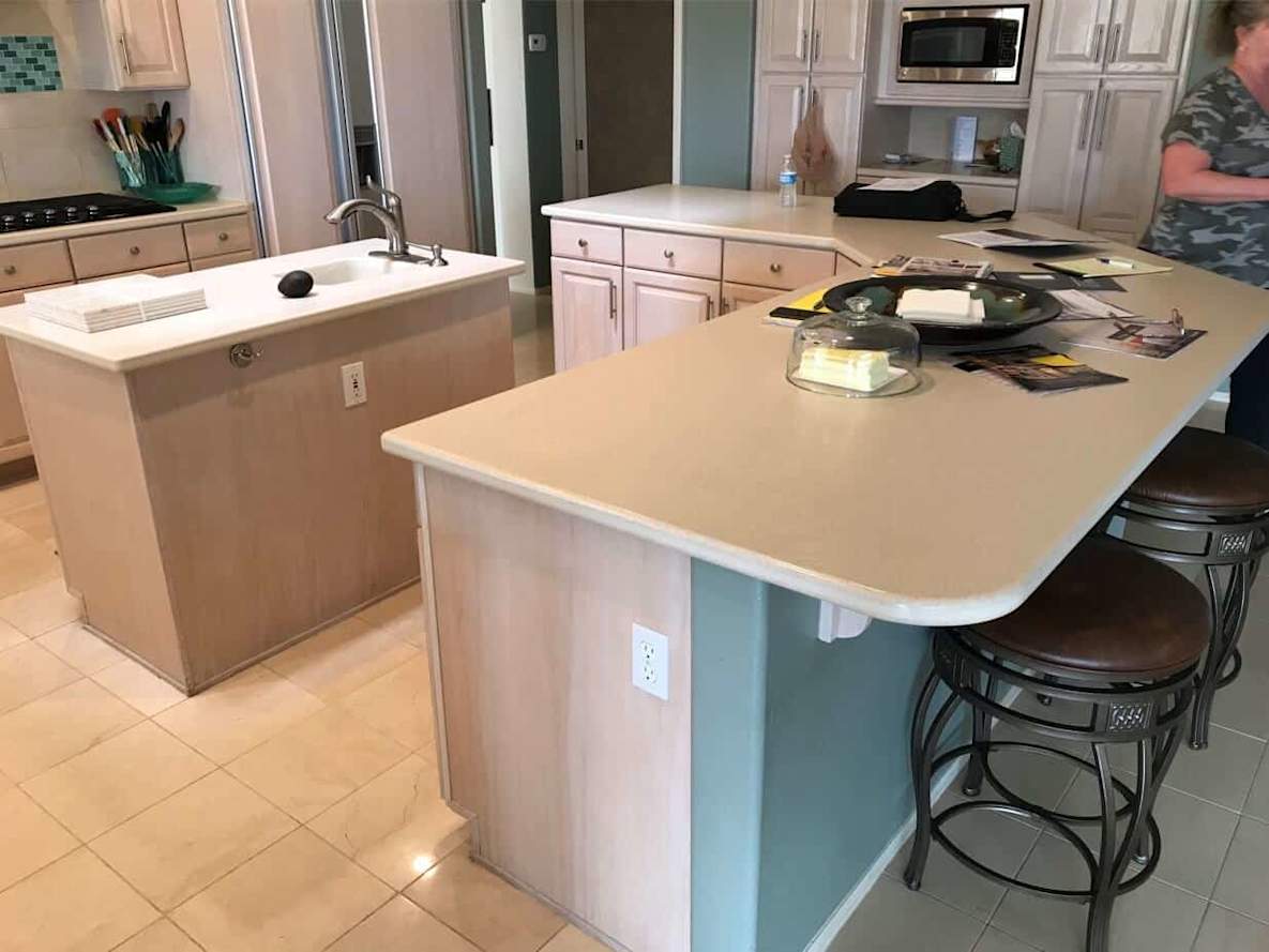 kitchen with white cabinets and light blue accent