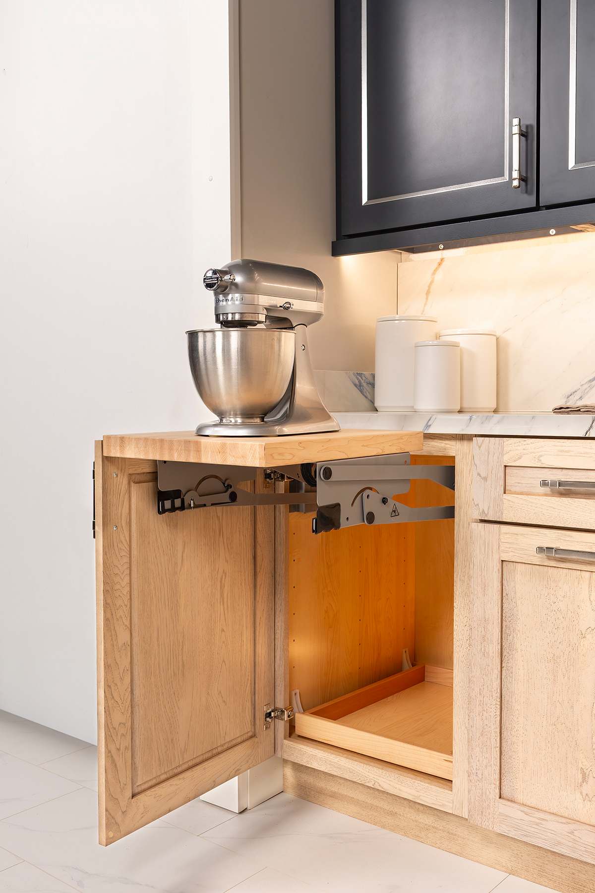 These Blue and Dark cabinets for the 2025 Exhibit Booth home were provided by Wellborn Cabinet, Inc.