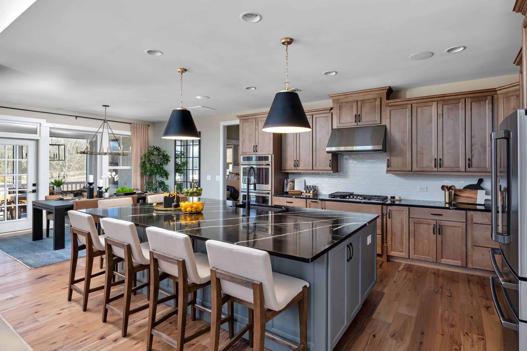 A Maple Kitchen featuring Henlow Square cabinet doors in River Rock and Willow from Wellborn Cabinet, Inc.
