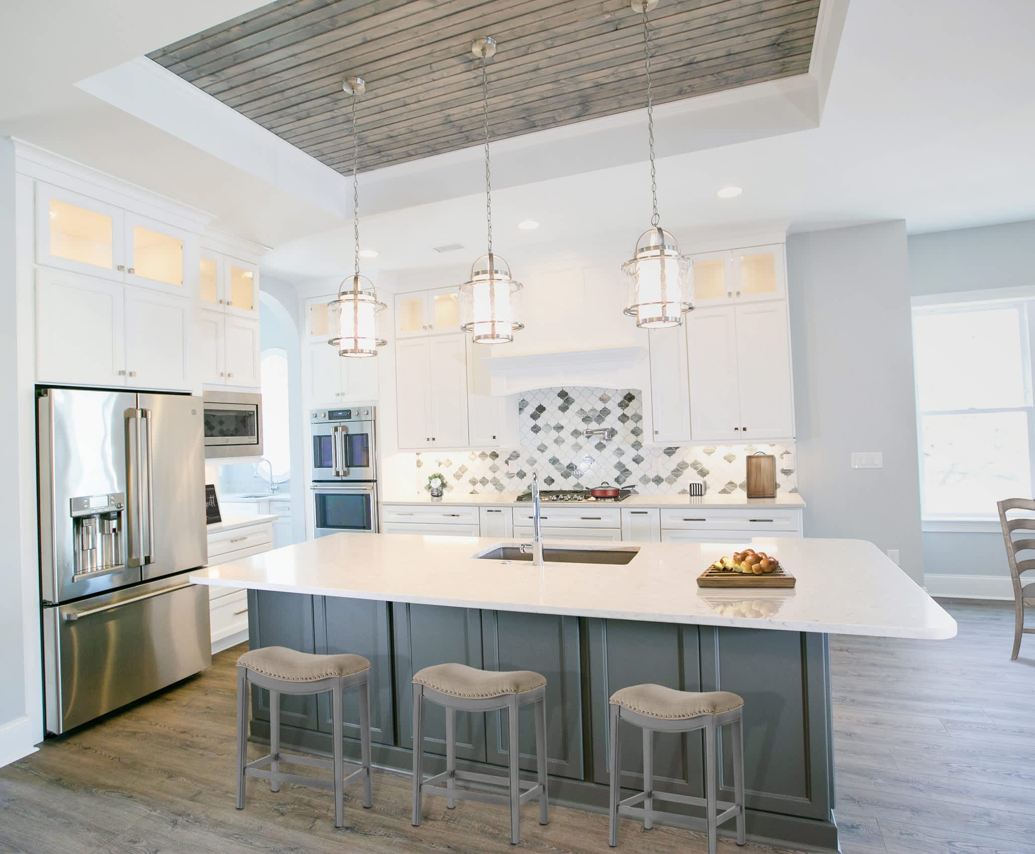 A Maple Kitchen featuring Henlow Square cabinet doors in Glacier and Willow from Wellborn Cabinet, Inc.