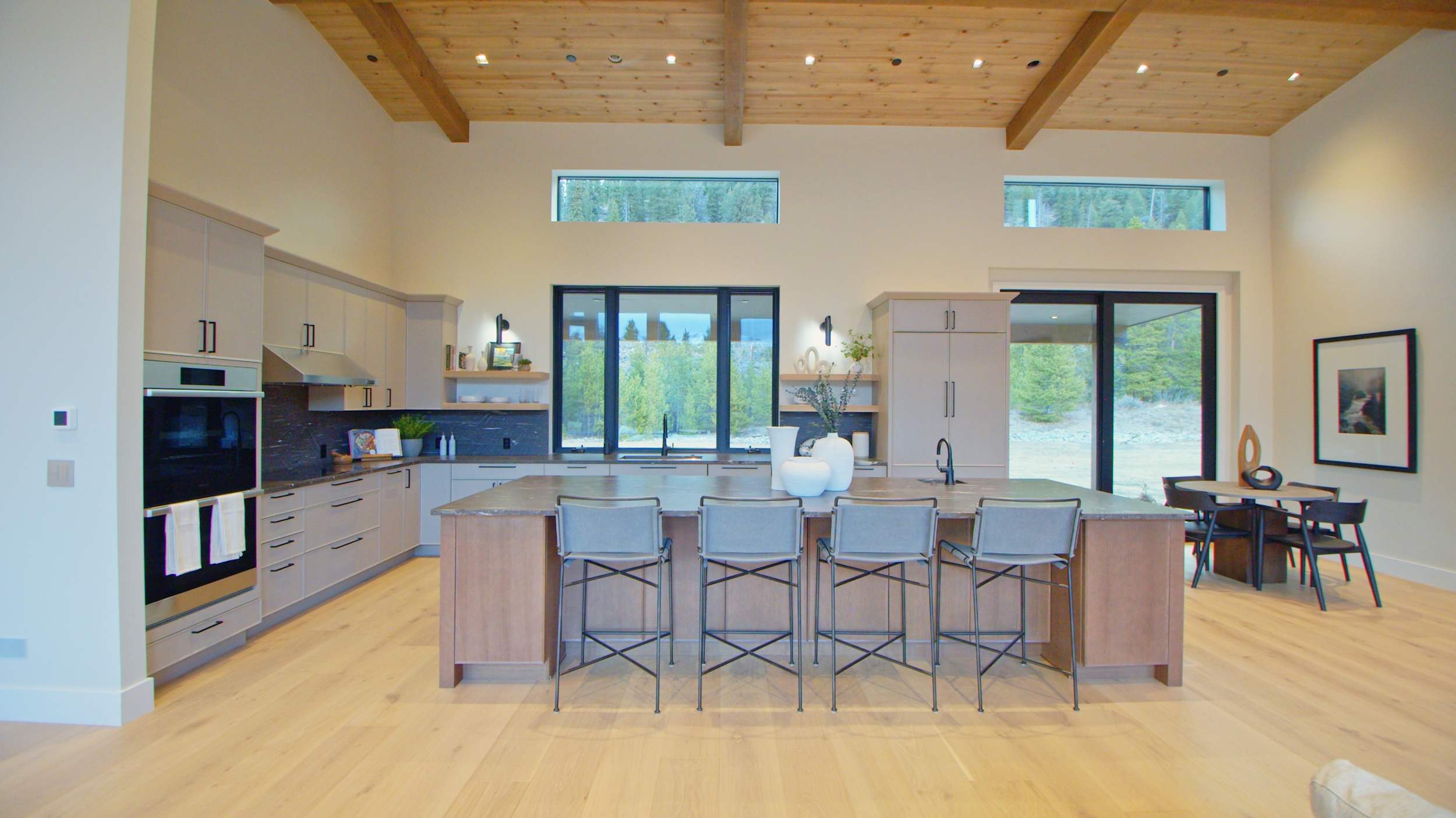 A Maple and Oak Kitchen featuring Muriel cabinet doors in Pebble and River Rock from Wellborn Cabinet, Inc.