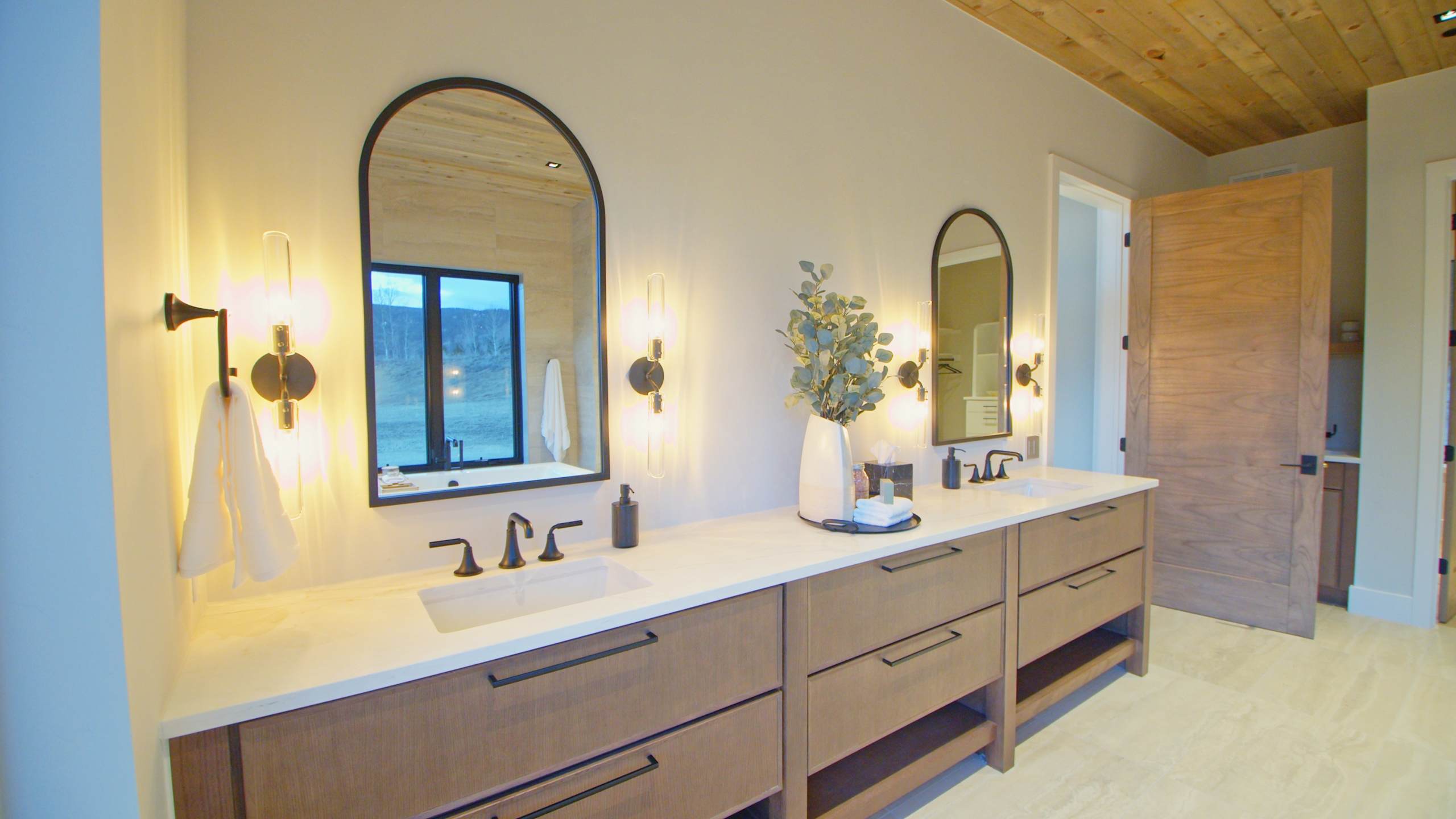 A Oak Bath featuring Muriel cabinet doors in River Rock from Wellborn Cabinet, Inc.