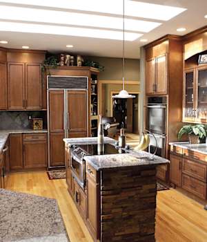 A Maple Kitchen featuring Harmony cabinet doors in Caramel Java from Wellborn Cabinet, Inc.