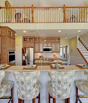 A Maple Kitchen featuring Savannah cabinet doors in Caramel Java from Wellborn Cabinet, Inc.