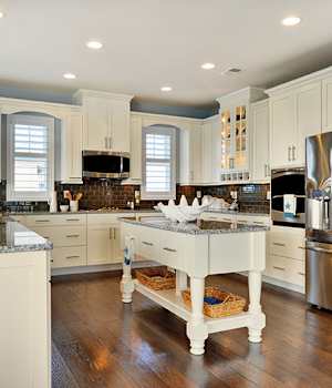 A Maple Kitchen featuring Hanover cabinet doors in Glacier Pewter from Wellborn Cabinet, Inc.