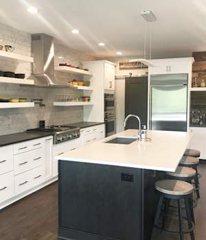 A Maple and Medium Density Fiberboard Kitchen featuring Hanover and Hancock cabinet doors in Glacier and Shadow from Wellborn Cabinet, Inc.