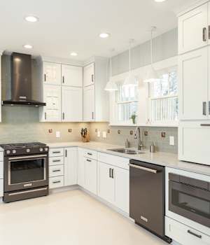 A Maple Kitchen featuring Hanover cabinet doors in Oyster White from Wellborn Cabinet, Inc.