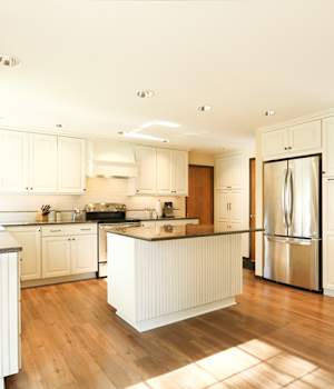 A Maple Kitchen featuring Bedford Square cabinet doors in Divinity Java from Wellborn Cabinet, Inc.