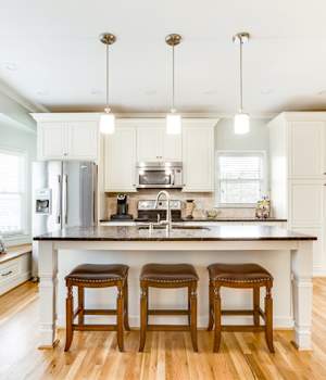 A Medium Density Fiberboard Kitchen featuring Belmont cabinet doors in Glacier from Wellborn Cabinet, Inc.