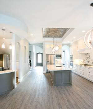 A Maple Kitchen featuring Henlow Square cabinet doors in Glacier and Willow from Wellborn Cabinet, Inc.