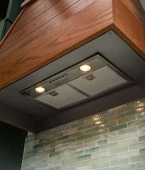 These Medium, Brown, and ColorInspire cabinets for the 2020 Exhibit Booth home were provided by Wellborn Cabinet, Inc.