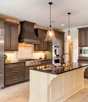 A Maple Kitchen featuring Millbrook Square cabinet doors in Divinity and Drift from Wellborn Cabinet, Inc.