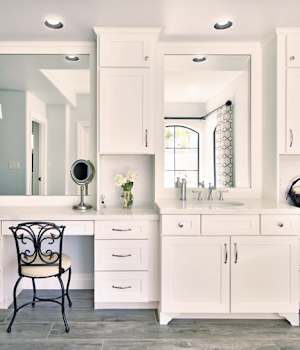 A Maple Bath featuring Hanover cabinet doors in Bright White from Wellborn Cabinet, Inc.