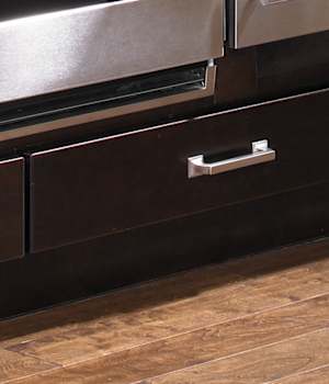 These Dark and Brown cabinets for the 2012, 2011, and 2010 Exhibit Booth home were provided by Wellborn Cabinet, Inc.