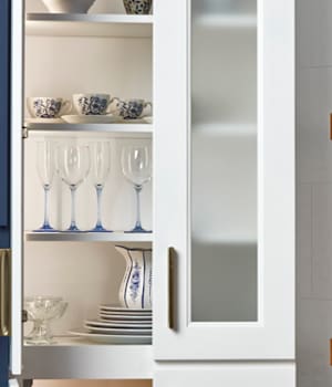 These Light and White cabinets for the 2021 Exhibit Booth home were provided by Wellborn Cabinet, Inc.