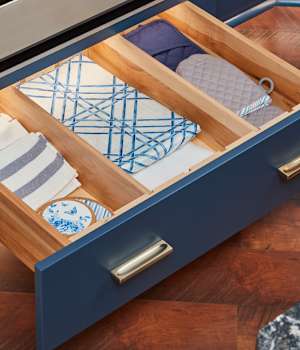 These Blue and Medium cabinets for the 2021 Exhibit Booth home were provided by Wellborn Cabinet, Inc.