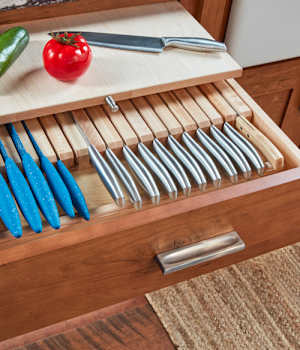 These Brown and Light cabinets for the 2021 Exhibit Booth home were provided by Wellborn Cabinet, Inc.