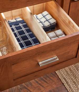 These Brown and Light cabinets for the 2021 Exhibit Booth home were provided by Wellborn Cabinet, Inc.