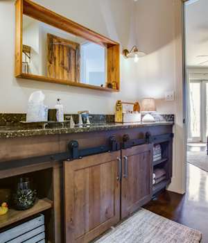 A Character Maple Bath featuring Hanover cabinet doors in Drift from Wellborn Cabinet, Inc.
