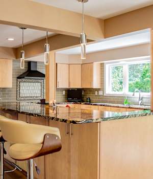 A Maple Kitchen featuring Urban cabinet doors in Light from Wellborn Cabinet, Inc.