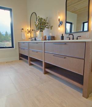 A Oak Bath featuring Muriel cabinet doors in River Rock from Wellborn Cabinet, Inc.