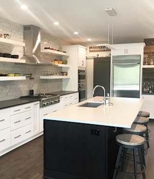 A Medium Density Fiberboard and Maple Kitchen featuring Hancock and Hanover cabinet doors in Glacier and Nightfall from Wellborn Cabinet, Inc.