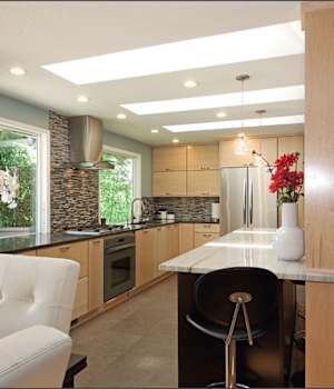 A Maple Kitchen featuring Milan cabinet doors in Natural from Wellborn Cabinet, Inc.
