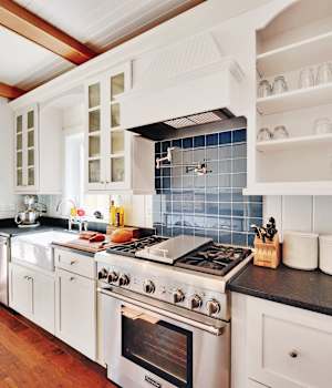 A Maple Kitchen featuring Hanover cabinet doors in Bright White from Wellborn Cabinet, Inc.