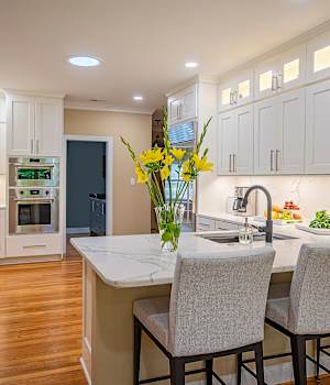 A Medium Density Fiberboard Kitchen featuring Bishop cabinet doors in Bright White from Wellborn Cabinet, Inc.