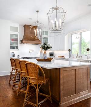 A Maple Kitchen featuring Galena Square cabinet doors in Bright White and Caramel from Wellborn Cabinet, Inc.