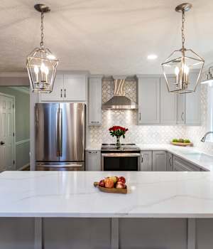 A Maple Kitchen featuring Prairie cabinet doors in Dove Pewter from Wellborn Cabinet, Inc.