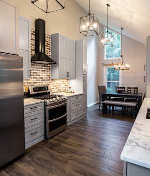 A Medium Density Fiberboard Kitchen featuring Saybrook cabinet doors in Dove from Wellborn Cabinet, Inc.