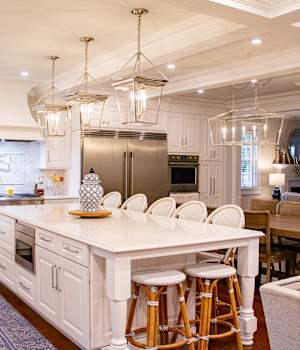 A Medium Density Fiberboard Kitchen featuring Trestle cabinet doors in Bright White from Wellborn Cabinet, Inc.