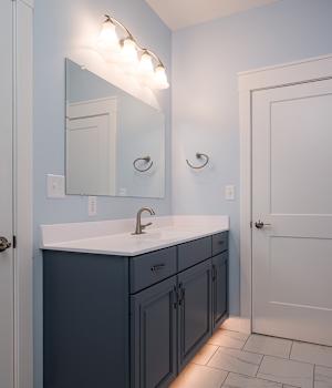 A Medium Density Fiberboard Bath featuring Hartford cabinet doors in Bleu from Wellborn Cabinet, Inc.
