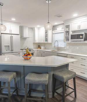 A Medium Density Fiberboard Kitchen featuring Hancock and Saybrook cabinet doors in Bright White and Willow from Wellborn Cabinet, Inc.