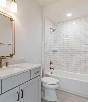 A Medium Density Fiberboard Bath featuring Hancock cabinet doors in Gray Mist from Wellborn Cabinet, Inc.