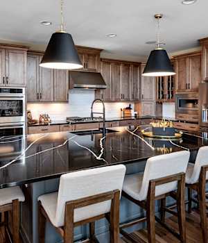 A Maple Kitchen featuring Henlow Square cabinet doors in River Rock and Willow from Wellborn Cabinet, Inc.