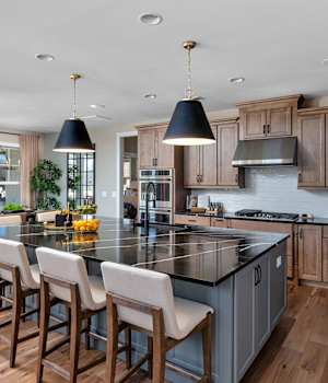 A Maple Kitchen featuring Henlow Square cabinet doors in River Rock and Willow from Wellborn Cabinet, Inc.