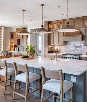 A Maple Kitchen featuring Lexington cabinet doors in River Rock and Willow from Wellborn Cabinet, Inc.