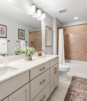 A Medium Density Fiberboard Bath featuring Galena Square cabinet doors in Gray Mist from Wellborn Cabinet, Inc.